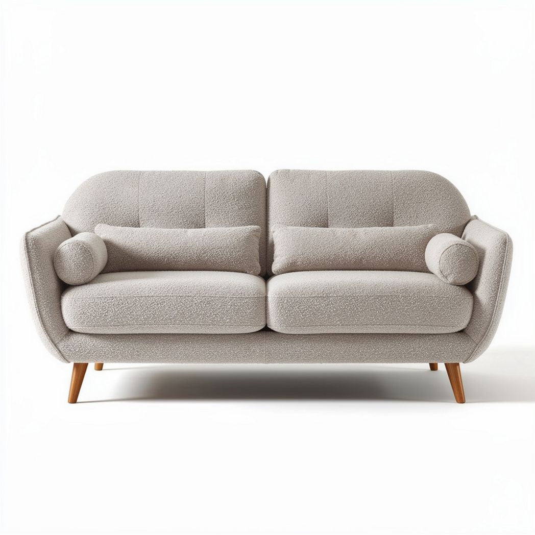 Two-seater sofa in plush fabric with wooden legs and accent pillows